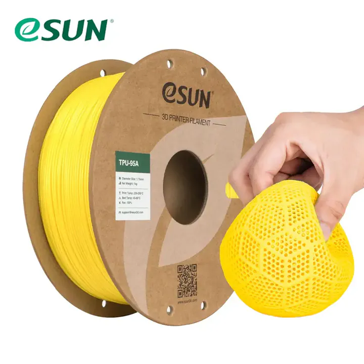 Bobina amarilla de TPU 95A junto a una pieza flexible de referencia